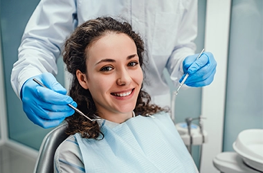 Lady Recieving A Dental Teeth Cleaning