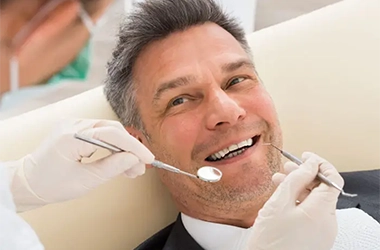 Man Recieving A Dental Exam