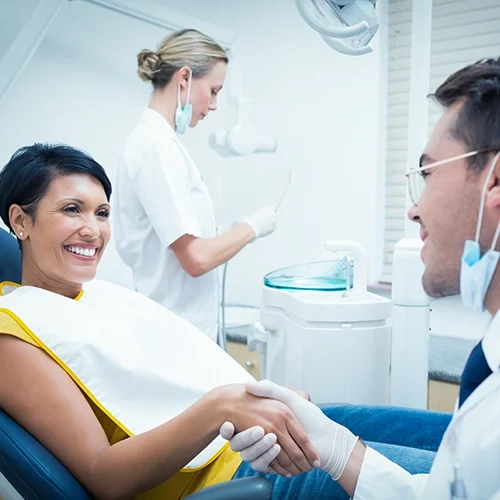 Doctor Checking In With Dental Patient